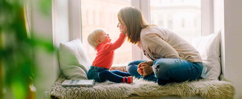 mom and baby enjoying clean carpets and upholstery